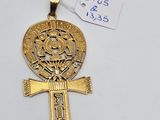 an egyptian cross pendant with a gold plated cross on it