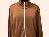the mannequin is wearing a brown jacket with a pink stripe on it