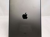 a close up of the back of an ipad with a black apple logo on it