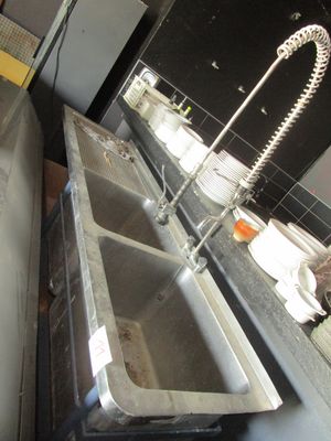 a sink and a faucet in a kitchen