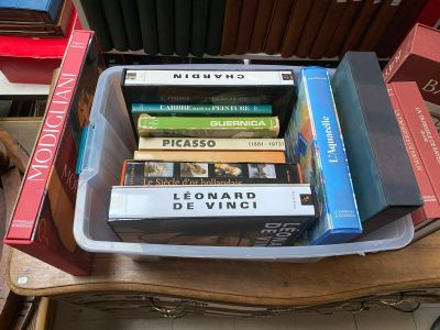 a stack of books sitting on top of a wooden table