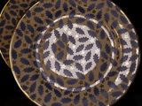 two plates that are sitting on top of each other