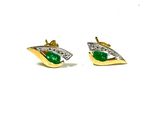 a pair of earrings with green stones on a white background