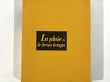 une boîte jaune sur laquelle est apposée une étiquette noire