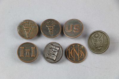 several coins with the names of different countries on them