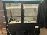 an image of a glass display case in a warehouse