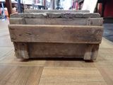 a wooden box that is sitting on the floor