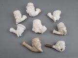 a lot of small white figurines that are on a table