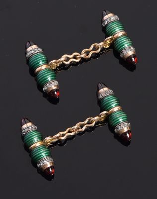 a pair of emerald and gold ear clips