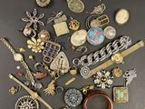 many different types of jewelry on the table