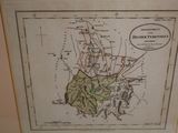 an old map of the island of hawaii in a frame on a wall