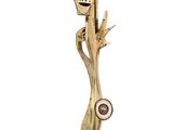 wooden sculpture of a man with a face on a tree branch
