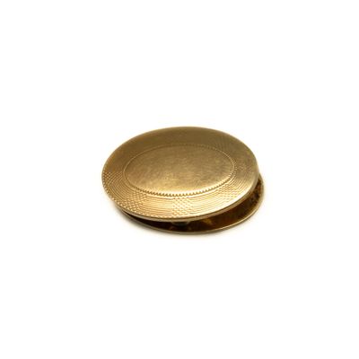 a picture of a gold plate on a white surface