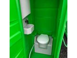 a green portable toilet with a sink and a toilet paper dispenser
