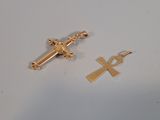 an image of a cross and an ankht on a white surface