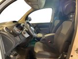 the interior of a car with the door open and the driver ' s seat down