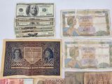 several different types of paper money laid out on a white surface