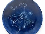 a blue plate with a drawing of a person on it