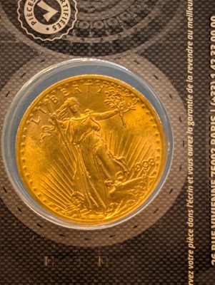 a close up of a coin in a package on a table