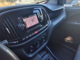 the dashboard of a car with a gps device in the center of it