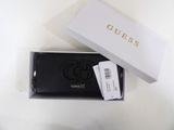 black leather wallet with gold logo on the front and a white box