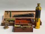 a box with a telescope and other items in it