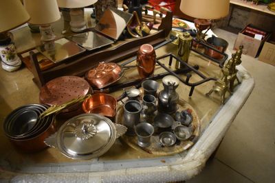 a table with a lot of pots and pans on it