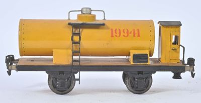 a yellow train car with a yellow tank on it