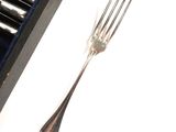 a fork and a knife sitting next to each other on a table