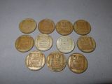 some old chinese coins sitting on top of a table