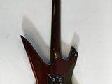 a guitar that is sitting on a white surface