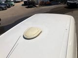 an image of a white van parked in a parking lot