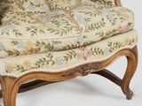 an old fashioned chair with floral upholstered upholstered seat