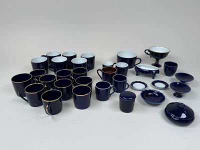 a lot of coffee cups and saucers on the table