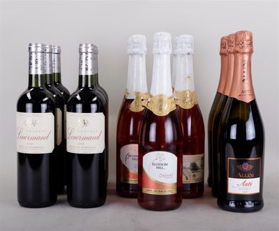 several bottles of wine are lined up on a table