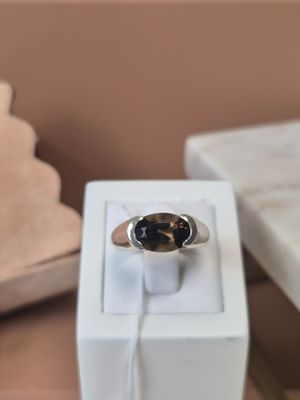 a ring that is sitting on top of a white box