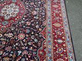an image of a large oriental rug on the floor