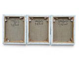 two framed pictures of a couple of white frames with writing on them