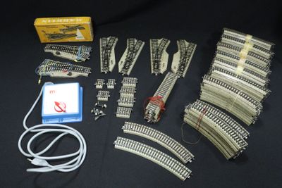 a lot of train tracks and wires on the table