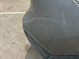 a close up of a car ' s bumper with a sticker on it