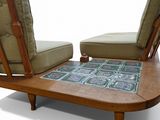 two chairs and a table with a rug on them on a white background