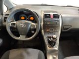the interior of a car with a steering wheel and dashboard controls