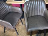 three chairs sitting next to each other on a wooden floor
