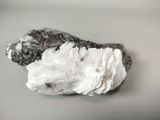 two pieces of white and black rock on a table