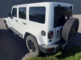 a white jeep parked in front of a building