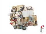 a pile of old books and papers on a white surface