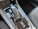 a cell phone sitting in the center console of a car