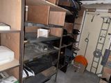 a room that has a lot of shelves and a door