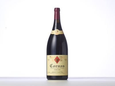 a bottle of red wine sitting on top of a table