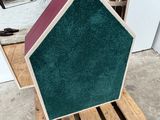 a small house made out of wood on a pallet